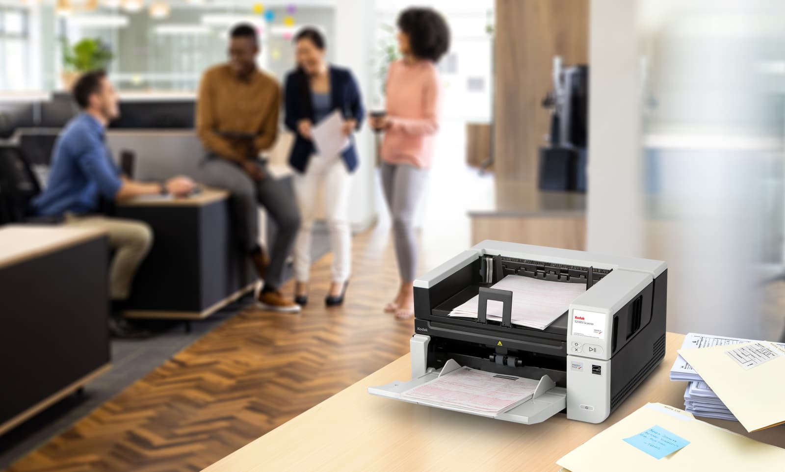 A document scanner in use in a working office